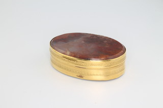 A 19th Century silver gilt oval snuff box with hard stone mounts 60mm x 45mm 