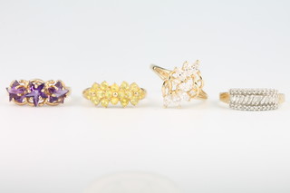 Four 9ct yellow gold gem set rings sizes O, O, Q and Q 