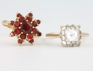 2 9ct yellow gold rings 1 set with garnets the other paste sizes L and M 