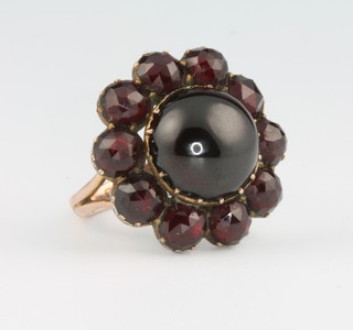 A 9ct yellow gold cabochon cut garnet cluster ring size N 1/2