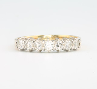 An 18ct yellow gold 7 stone diamond half hoop ring size O