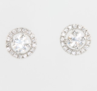 A pair of 18ct white gold single stone halo set diamond ear studs, 0.33ct