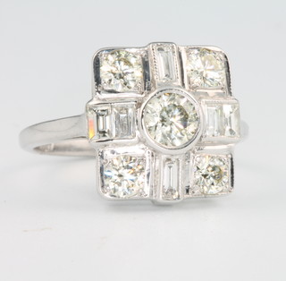 An 18ct white gold Art Deco style ring set with 6 baguette cut diamonds and 5 brilliant cut diamonds, approx. 1.5ct size M 