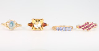 Four 9ct yellow gold gem set rings size R 