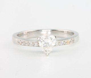 An 18ct white gold heart shaped diamond ring, approx 0.60ct, size O, complete with an EDR report