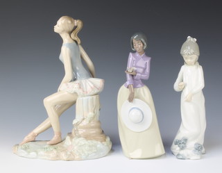 A Nao figure of a standing girl 27cm, a Nao figure of a girl with dog 24cm and a Nadal figure of a seated ballerina 21cm