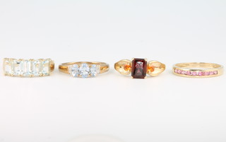 Four 9ct yellow gold gem set rings size P, P, Q and Q