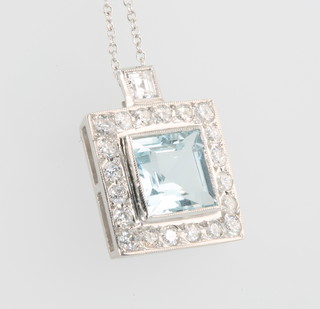 A white gold square cut aquamarine and diamond pendant on a ditto chain 