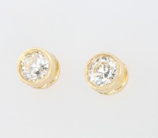A pair of 18ct yellow gold single stone diamond ear studs approx 0.7ct