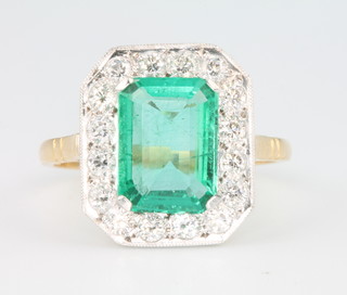 An 18ct yellow gold Art Deco style emerald and diamond ring, size O 
