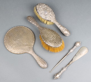 A silver engine turned hand mirror and brush, 1 other and 2 implements, rubbed date letters
