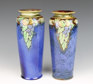 A pair of Doulton Lambeth blue salt glazed vases with fruit decoration, the base marked Doulton and with Doulton and Lambeth and stamp mark 26cm h 
