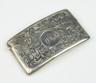 A silver visiting card case with chased scroll decoration and monogram Birmingham 1911, 36 grams 