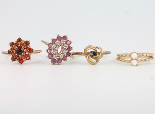 Four 9ct yellow gold gem set rings sizes H, L, N and N 