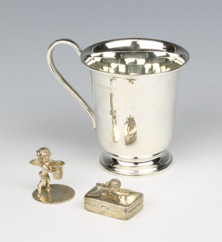 A silver christening mug Sheffield 1994, a pill box and a novelty candle holder in the form of an angel holding a thimble 98 grams