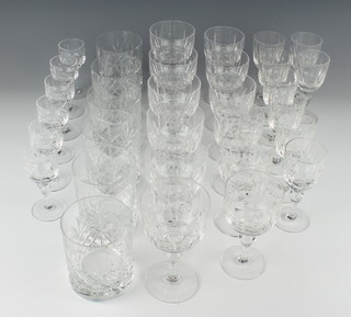 A suite of 32 cut glass drinking glasses comprising 6 wine glasses, 6 port glasses, 6 sherries, 8 liqueur and 6 cut glass tumblers 