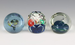 A Kosta Boda paperweight, 2 Caithness paperweights "First Quarter" and "Spring Top" boxed, 2 Langham paperweights, a Murano Archemesegus paperweight and 2 others 