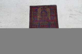 A brown and red ground Balochi prayer rug decorated a temple 140cm x 87cm 