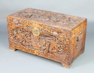 A carved Chinese camphor coffer the lid decorated  a Buddha and figures, 54cm h x 192cm w x 51cm d 
