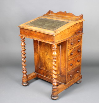 A Victorian figured walnut Davenport desk with raised three-quarter gallery, the pedestal fitted an inkwell drawer above 4 long drawers with spiral turned supports to the front, raised on bun feet 85cm h x 54m w x 54cm d 