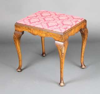 A rectangular walnut Queen Anne style stool with upholstered drop in seat raised on cabriole supports 28cm x 40cm  