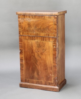 A 19th Century inlaid mahogany side cabinet, fitted shelves enclosed by a panelled door, raised on a platform base 35"h x 19"w x 12"d 