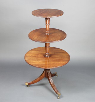 A 19th Century circular mahogany revolving 3 tier dumb waiter raised on a pillar and tripod base with brass cappings and castors largest diam. to the base 63cm, middle 50cm, top 40cm