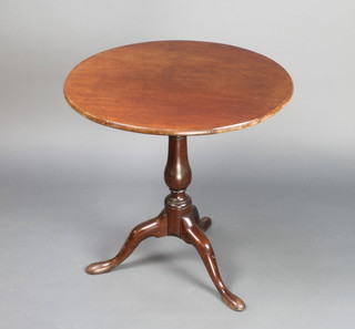 A Georgian circular mahogany snap top tea table with bird cage action, raised on a baluster turned column and tripod base 68 cm h x 69cm diam. 