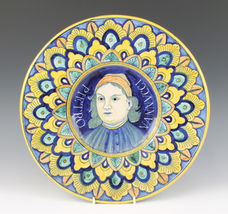 A 20th Century Italian Majolica wall plaque decorated with a portrait of a gentleman Pietro Vannucci enclosed in a stylised floral border, marked Deruta to the reverse, 37cm diam. 