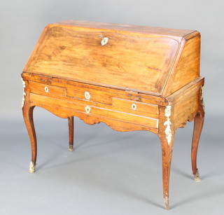 A French 18th Century fruitwood bureau with gilt metal mounts, the fall front revealing a well fitted interior, the base fitted 2 short and 1 long drawers, raised on cabriole supports 105cm h x 107cm w x 52cm d 