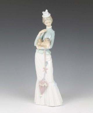 A Lladro figure of a lady holding a dog and with parasol, base impressed 4893 37cm h 