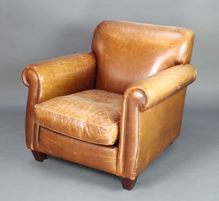 A club style armchair upholstered in brown leather, raised on square tapered supports 80cm h x 76cm w x 84cm d 