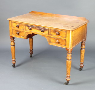 A Victorian bleached mahogany side table with raised back fitted 1 long and 4 short drawers 79cm h x 102cm w x 52cm d 