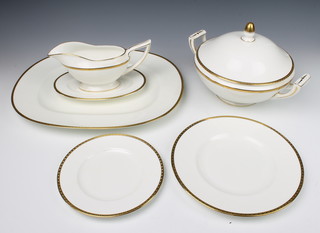 A Minton Golden Heritage part dinner service comprising 8 small plates, 8 medium plates, 8 dinner plates, 2 tureens and lids, a sauce boat and stand and a meat plate together with original invoice 