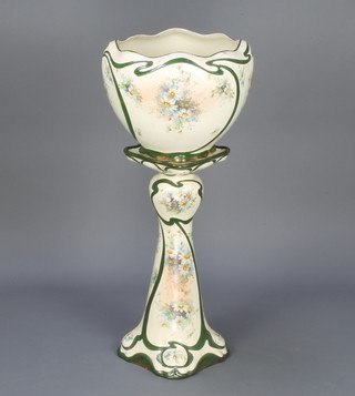 An Art Nouveau style ceramic jardiniere on stand decorated with spring flowers 96cm 