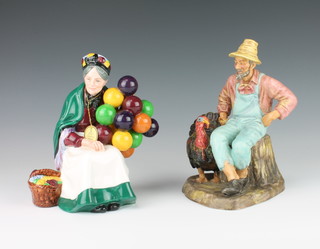 Two Royal Doulton figures - The Old Balloon Seller HN1315 18.5cm and Thanks Giving HN2446 20cm 