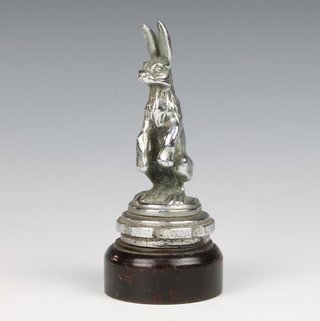 An Alvis chromium plated car mascot in the form of a standing hare, raised on a turned socle base 17cm 