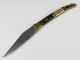 A 19th Century French (Thires) Navaja knife with 12.5cm blade, stamped Beauvoir and with remains of etching, having a brass, bone and tortoiseshell grip  
