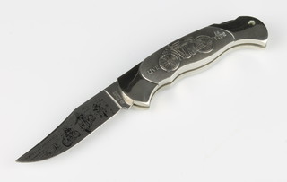 A Boker motorcycle knife "Harley Davidson Sturgis" 1993, the stainless steel etched clip point blade stamped Boker Solingen, having a stainless steel grip with pewter relief, serial number 9077 

