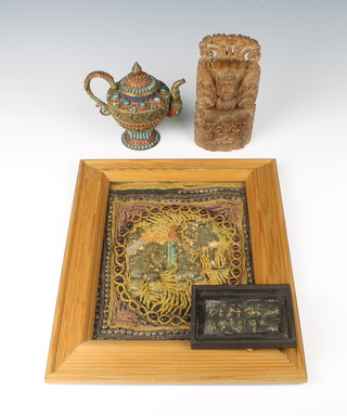 A Tibetan gilt metal and hardstone set teapot 13cm , a rectangular bronze plaque decorated figures 4cm x 8cm, a Balinese style carved hardwood figure of a seated deity 18cm x 8cm x 3cm and an Indian sequin and embroidered panel decorated an elephant 22cm x 17cm 