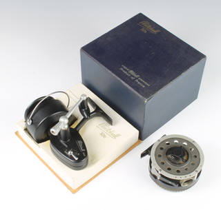 A Mitchell 700 automatic fly reel together with a Mitchell 306 fishing reel boxed