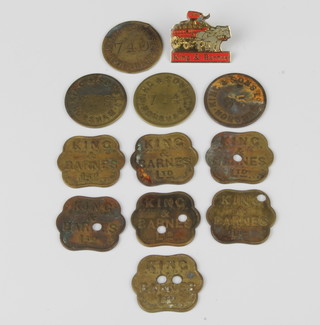 Of Horsham interest, 4 King & Sons beer tokens, 7 King & Barnes Ltd beer tokens, an enamelled car badge King & Barnes, all contained in a Sutton & Bufton Dentists 23a North Street Horsham cardboard box 