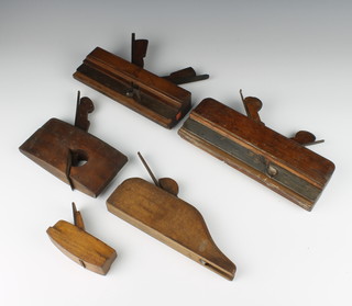 A small wooden smoothing plane, 2 wooden moulding planes and 2 others 
