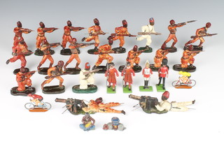 Twenty Italian C C Milano composition soldiers - African Rifleman together with 4 Britains metal figures of a guardsman, life guard and 2 Yeoman of the Guard, 2 lead figures of a cyclist, lead figure of a native Indian drummer and a camp fire 