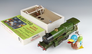 A Hornby O gauge clockwork locomotive in green livery (Flying Scotsman) no tender and dents to body, a German tinplate clockwork model of a duck marked Made in Germany Ges Gesch 14cm and a Subbuteo Combination edition comprising 2 goals and 2 balls boxed 