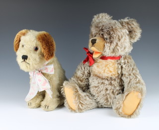 A figure of a seated dog 30cm together with a "Mohair" teddy bear 44cm 