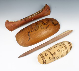 An Aboriginal turned wooden club 49cm x 49cm, 2 oval wooden dishes 3cm x 39cm and 3 cm x 29cm x 11cm, together with an American Indian birch bark canoe 11cm x 46cm x 10cm  