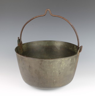 A circular brass cooking pot with iron swing handle 17cm x 29cm 