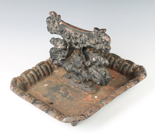 A Victorian black painted cast iron boot scraper 19cm x 32cm x 17cm 