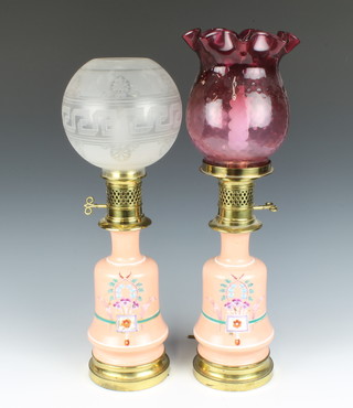 A pair of Victorian opaque orange glass oil lamps of club form converted to electric table lamps with glass shades 56cm 
